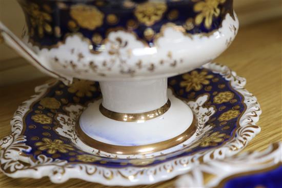 A Staffordshire dessert service, decorated in cobalt blue and gilt and painted topographical scenes